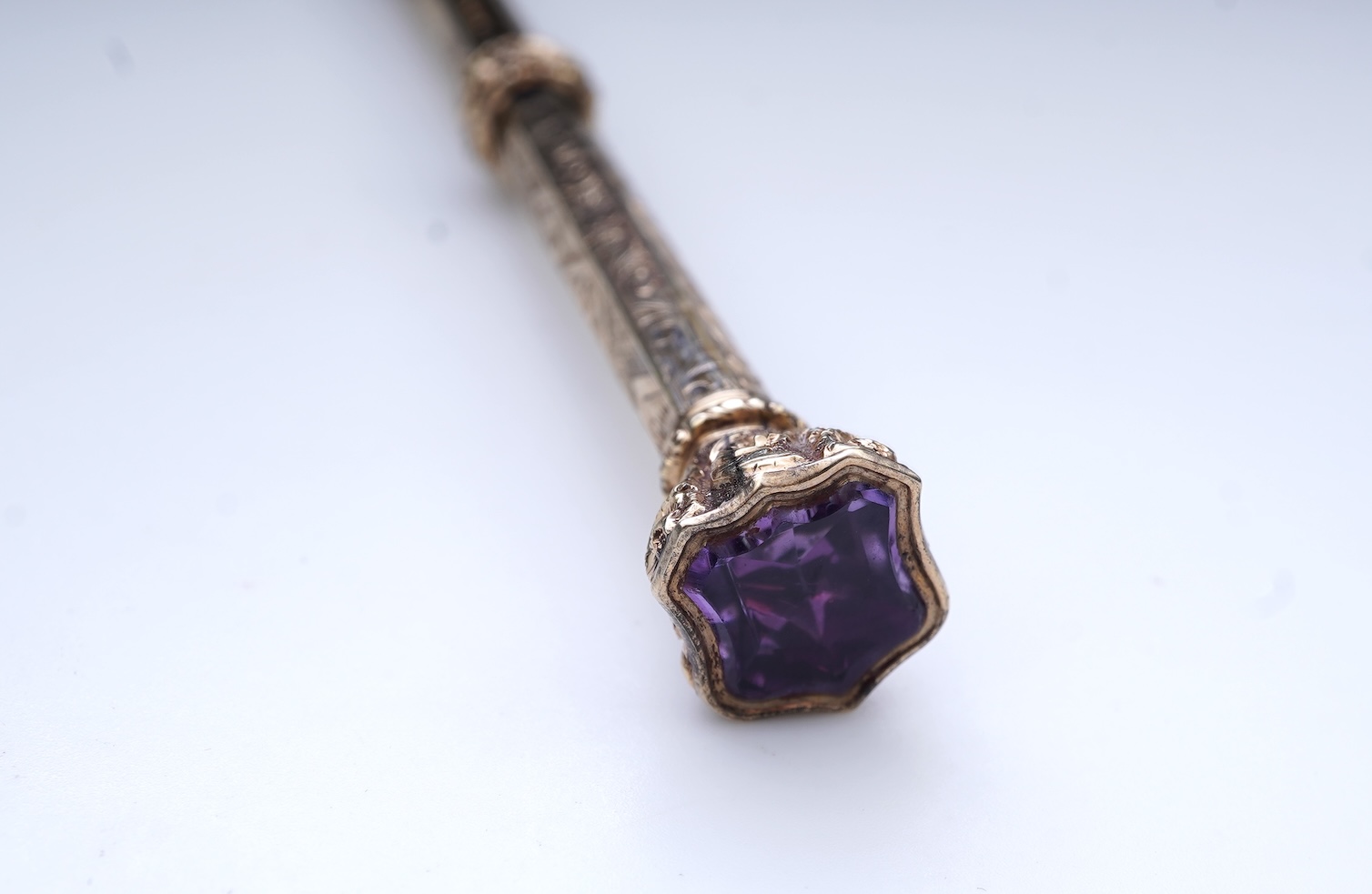 An early Victorian gold and amethyst mechanical pencil, mid 19th century